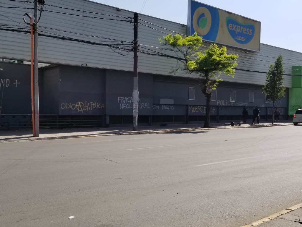 Graffiti, protesters, stores closed